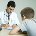 teen boy speaking with doctor